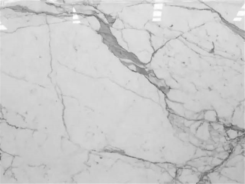 Polished Calacatta White marble close-up with grey veining