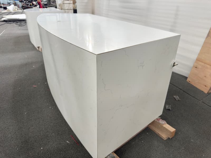 Curved counter with wooden cabniet