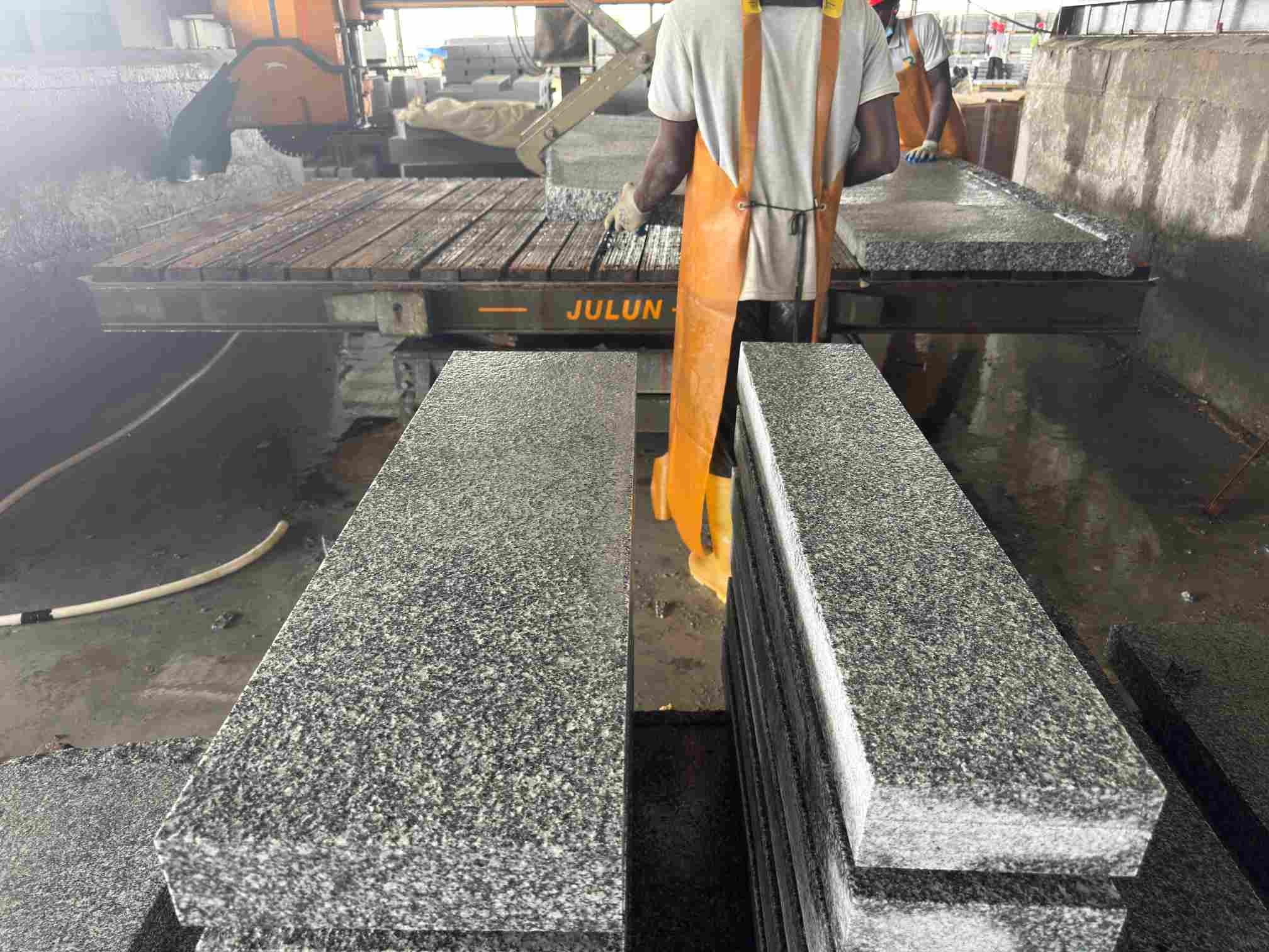 Tema Grey granite blocks being cut into project-sized steps and treads at the Ghana factory