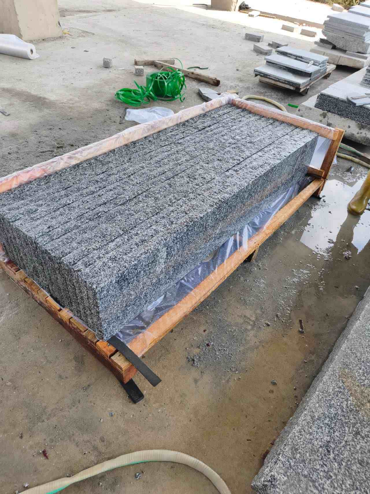 Export crates of Tema Grey granite treads labeled for project shipment
