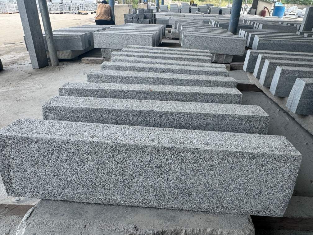 Seven-inch Tema Grey solid granite steps installed at an exterior entrance