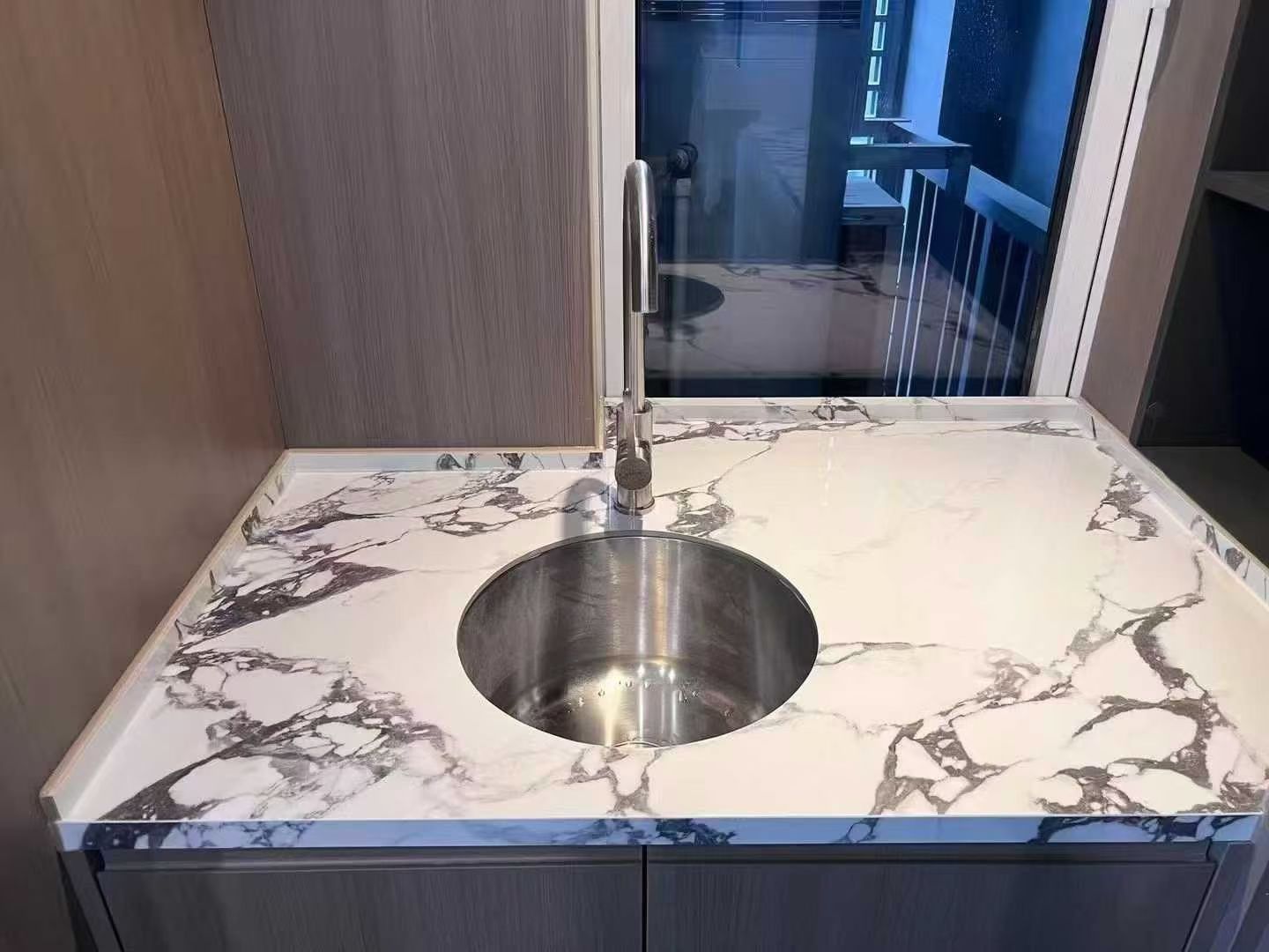Custom Calacatta Viola marble vanity countertop with round sink cutout