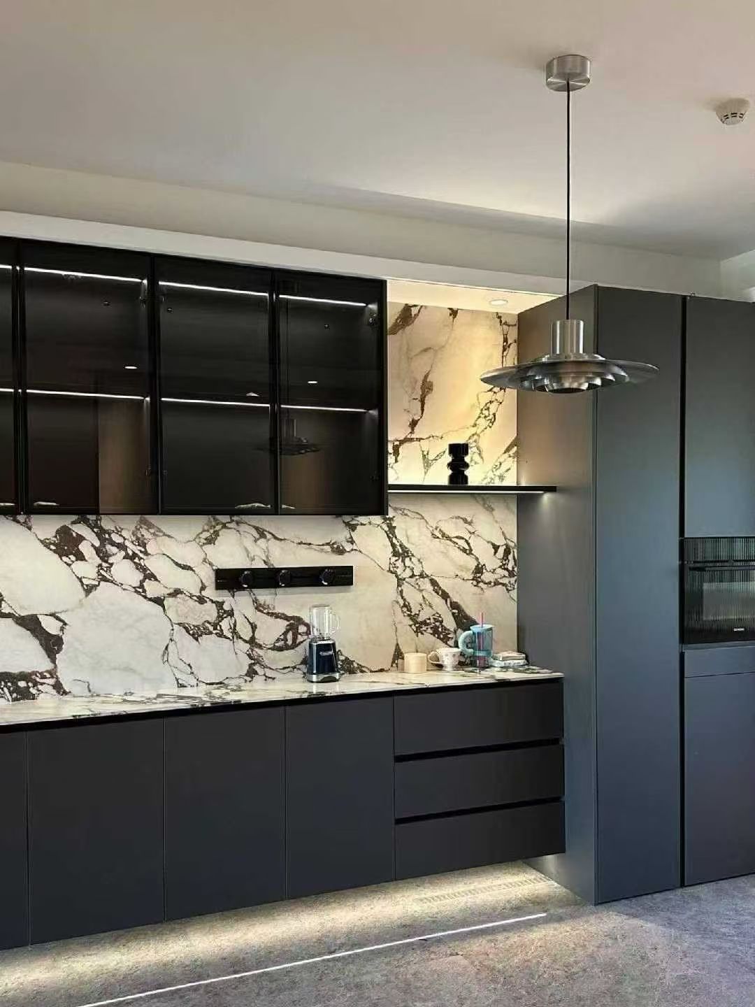 Calacatta Viola kitchen countertop and full-height marble backsplash
