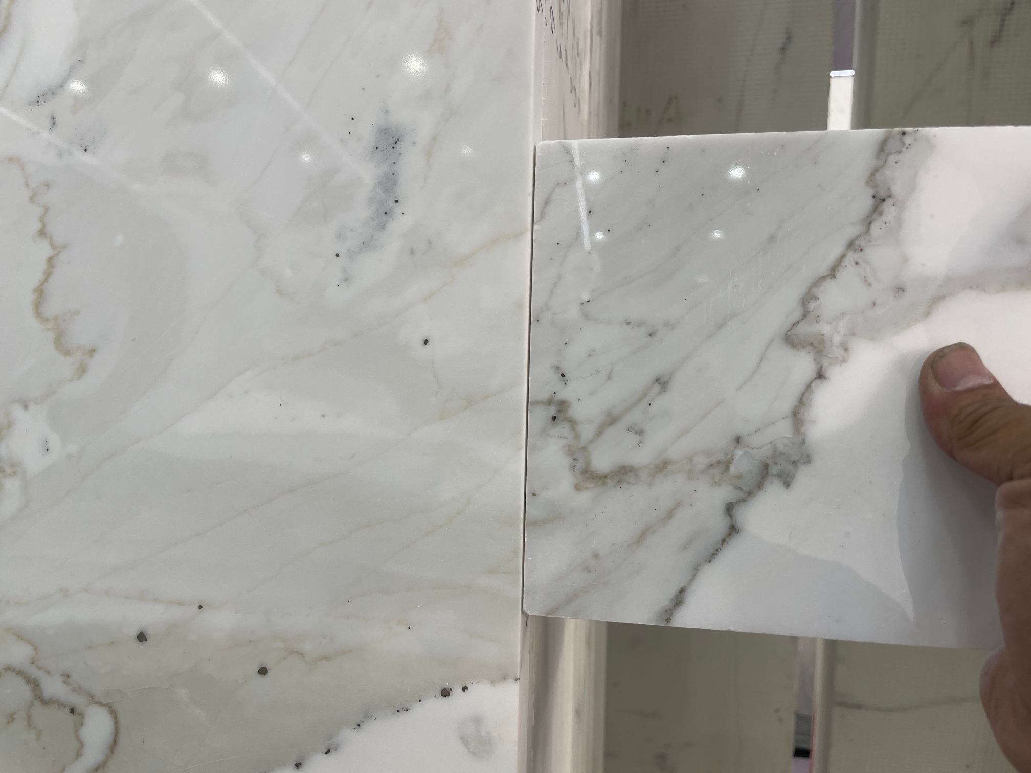 Customer Calacatta White sample matched to slab with side grey veining