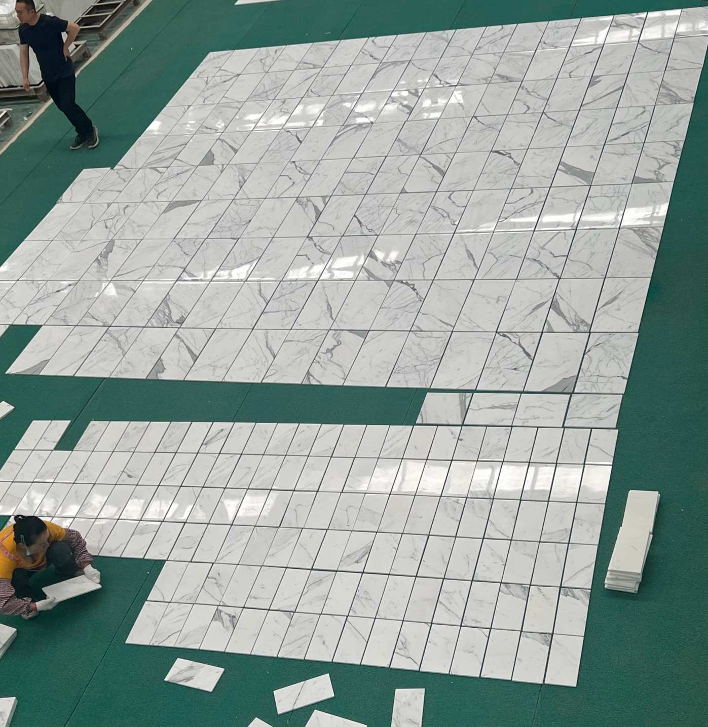 Large-area Calacatta White marble tile dry layout for a project