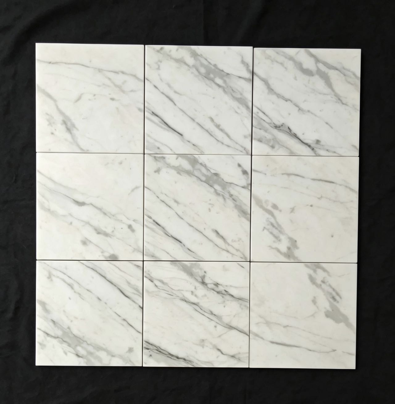 Cut-to-size Calacatta White marble tiles arranged for continuous veining