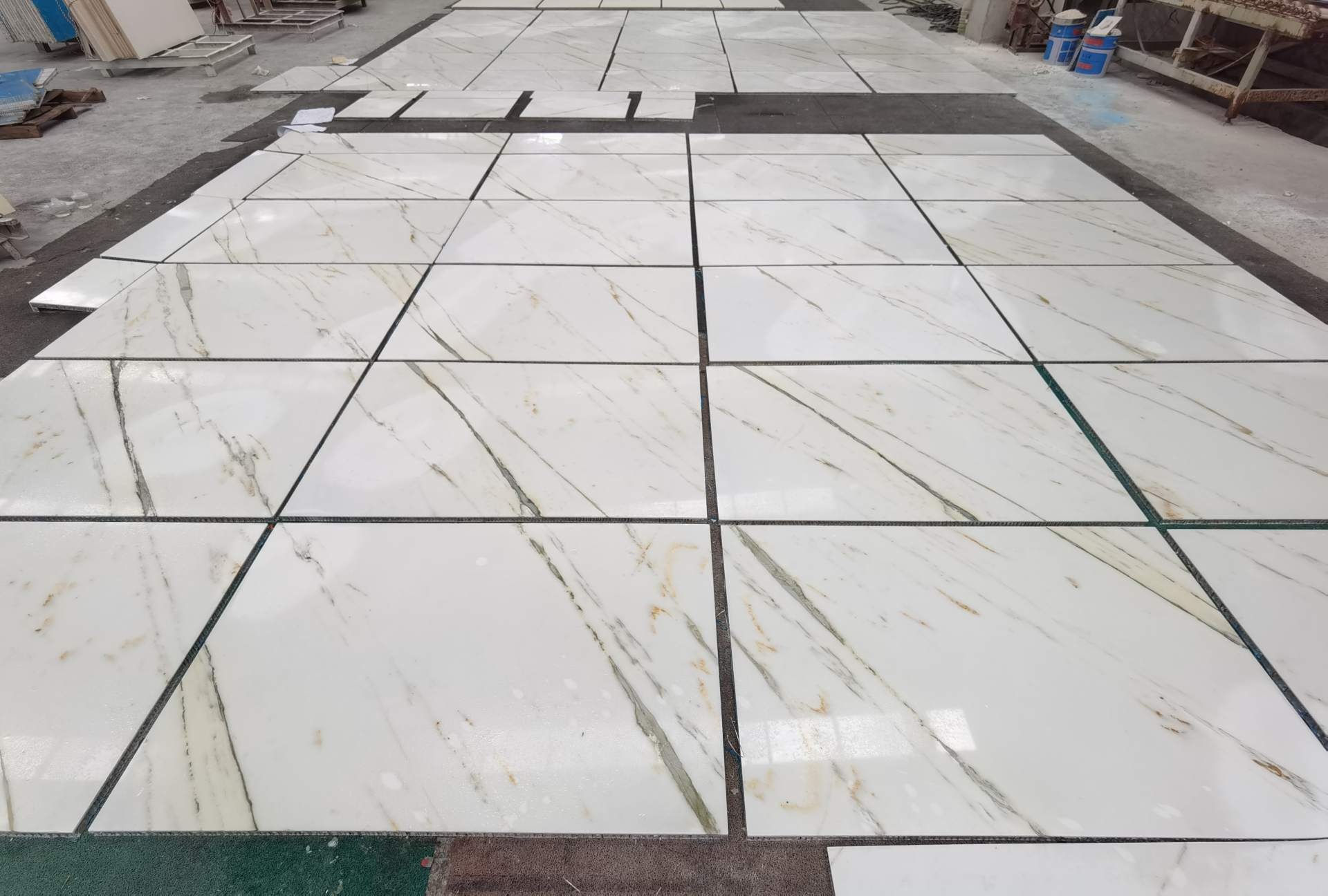 Oriental Calacatta White floor tiles pre-laid in the factory with fine black and light warm veining