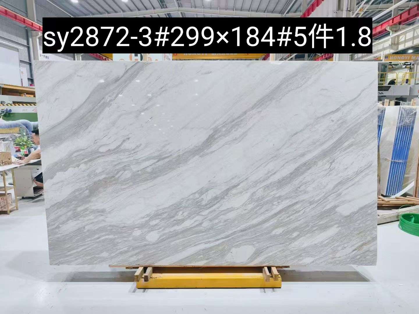 Spider Volakas marble slab with diagonal layered grey veins and expressive natural texture