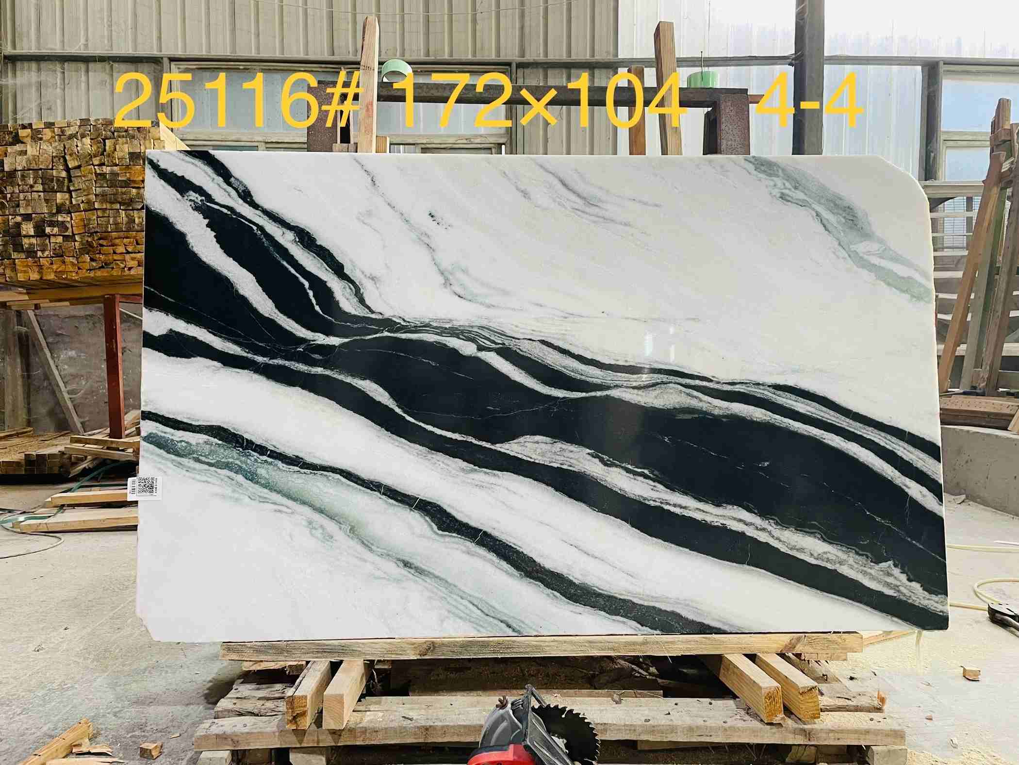 Panda White marble slab with bold black and dark grey bands across a white background